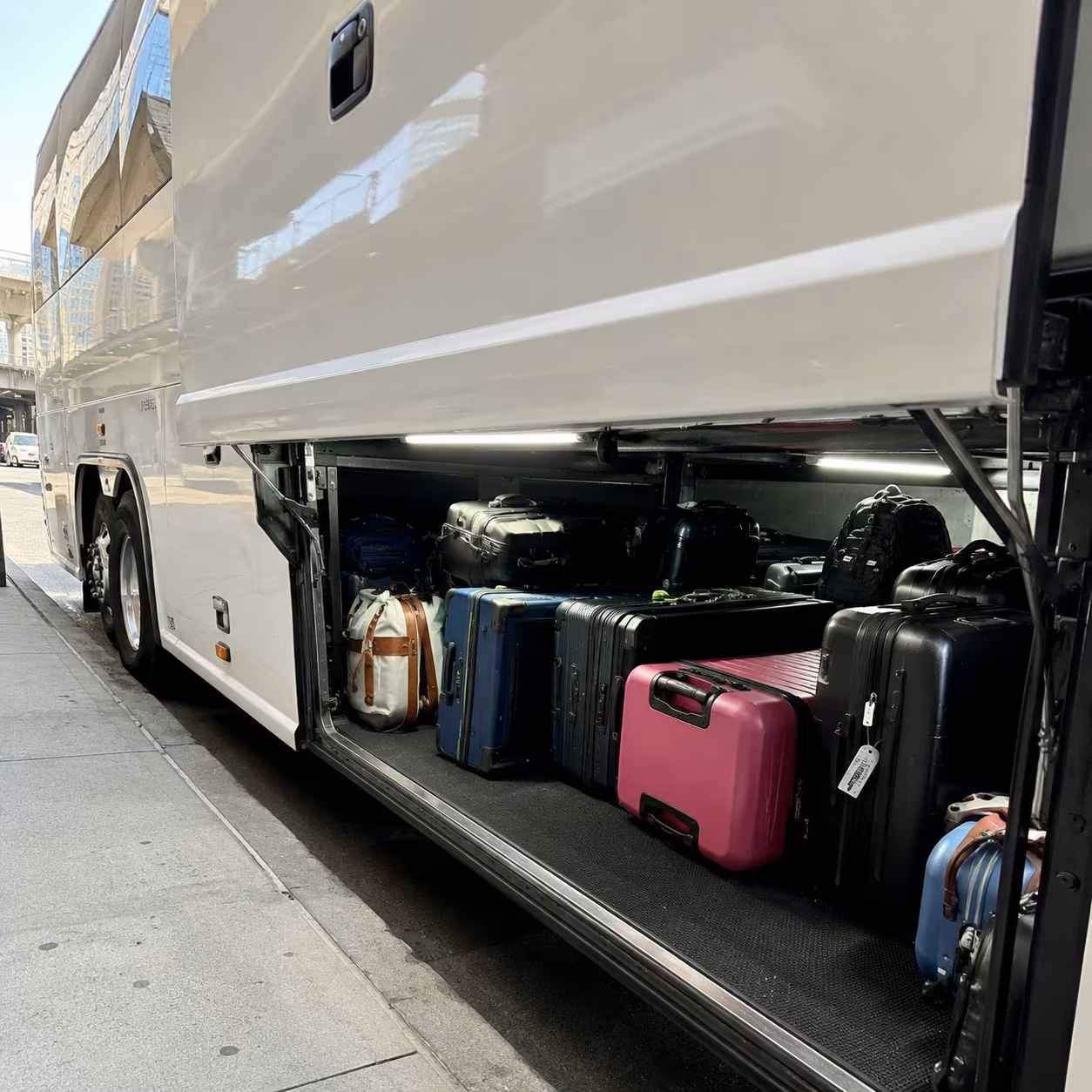 Luggage loaded into a Metro Atlanta motorcoach luggage bay