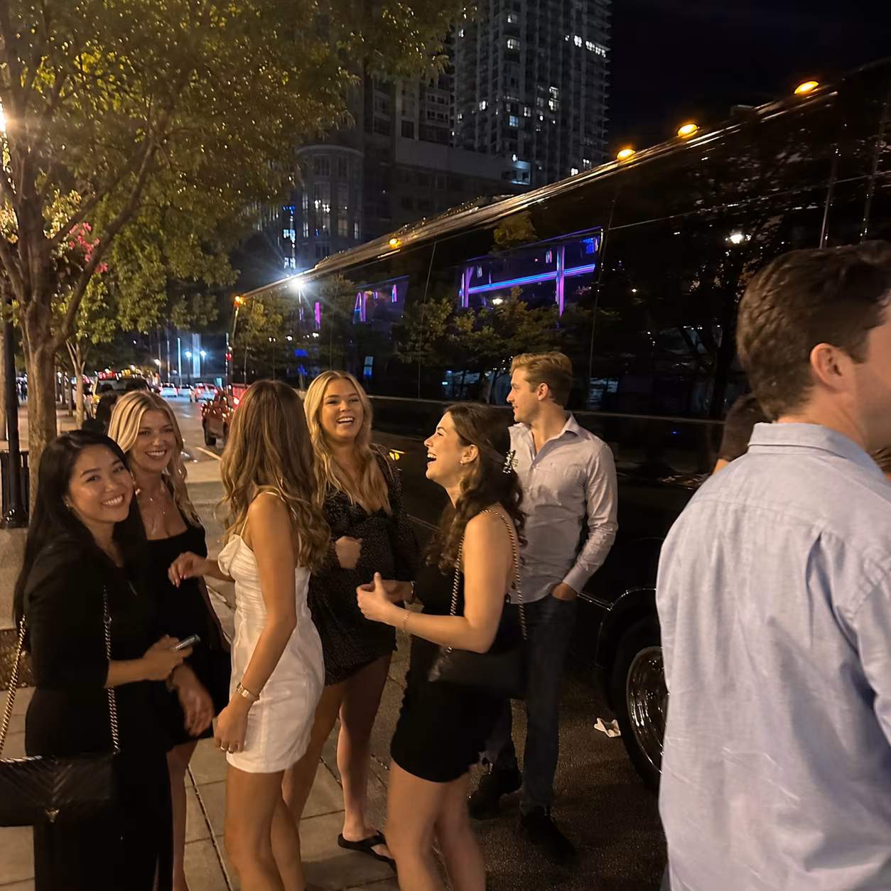 Late night downtown return for a metro Atlanta bachelor & bachelorette party bus rental