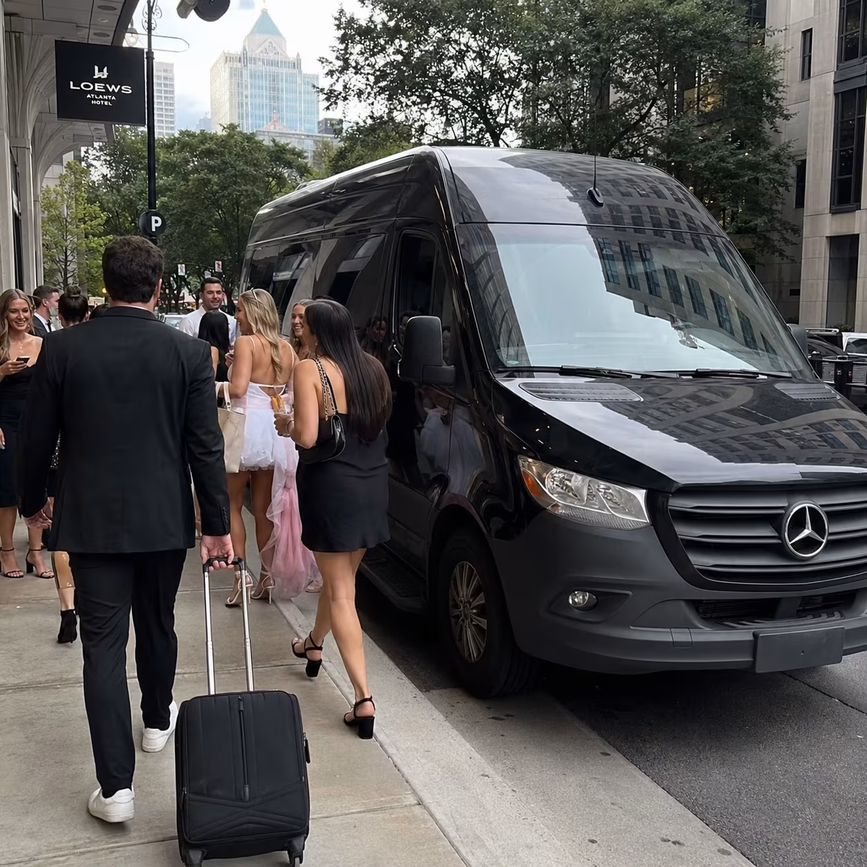Sprinter luggage boarding for a metro Atlanta bachelor & bachelorette party bus rental