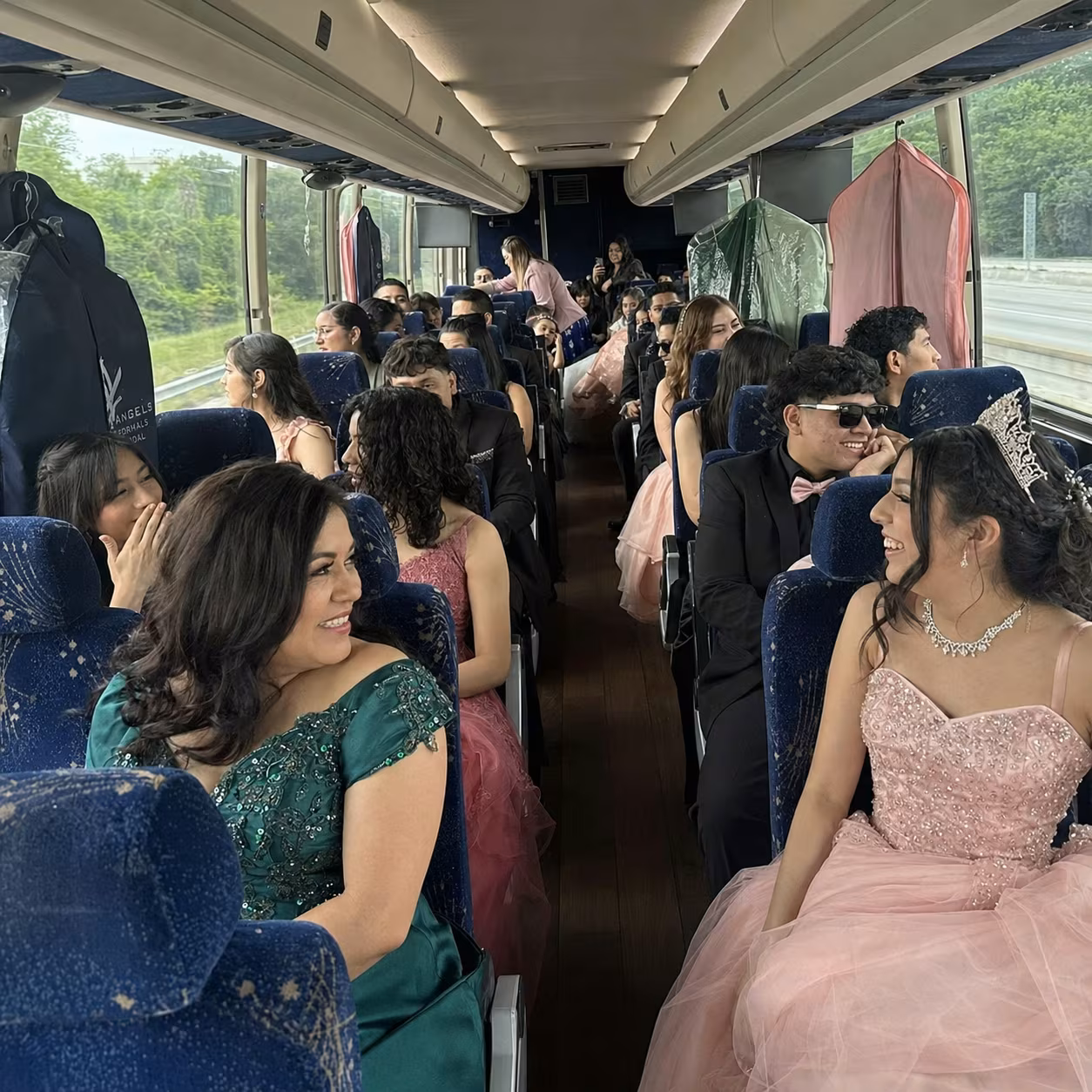 Quinceanera MCI interior garment bags for a metro Atlanta birthday party bus rental