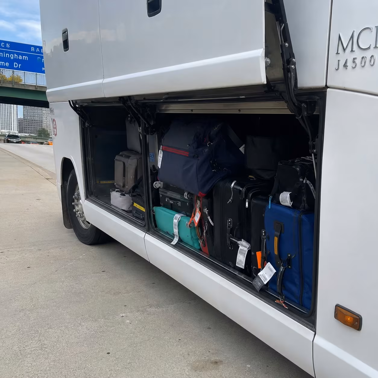 MCI j4500 luggage bay for a metro Atlanta concert party bus rental