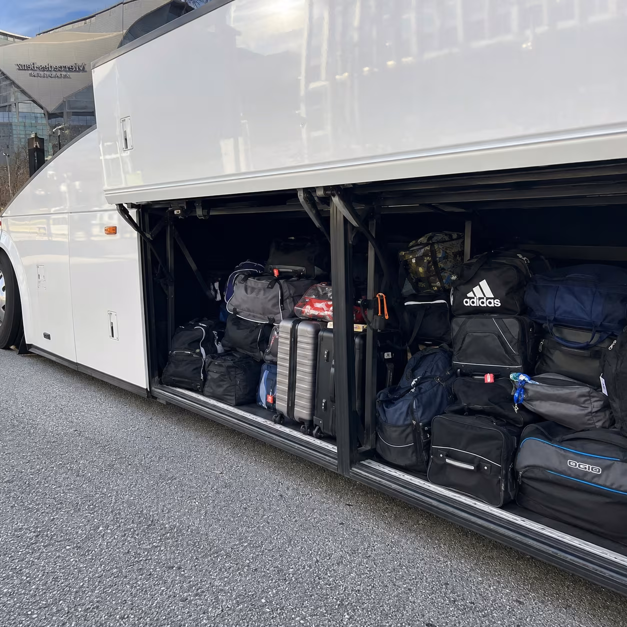 Sporting event bus charter bus luggage bay for a metro Atlanta sporting event party bus rental