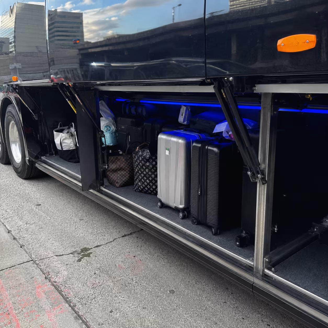 Sporting event bus party bus luggage bay for a metro Atlanta sporting event party bus rental